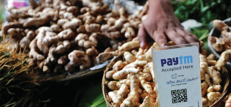 QR code on a market stall: Reuters/Alamy Stock Photo/Shailesh Andrade